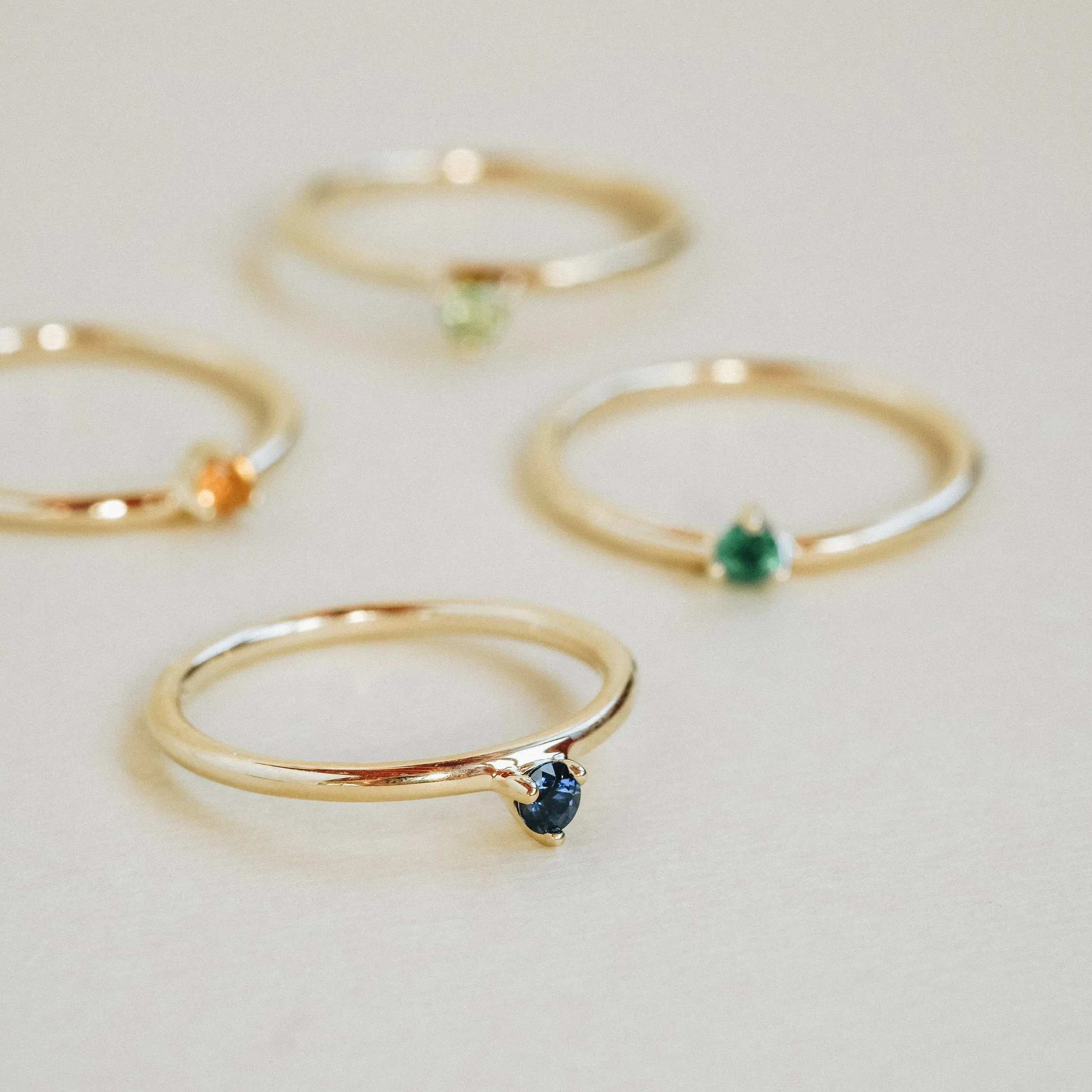 Three Claw Mini Peridot Ring in Yellow Gold