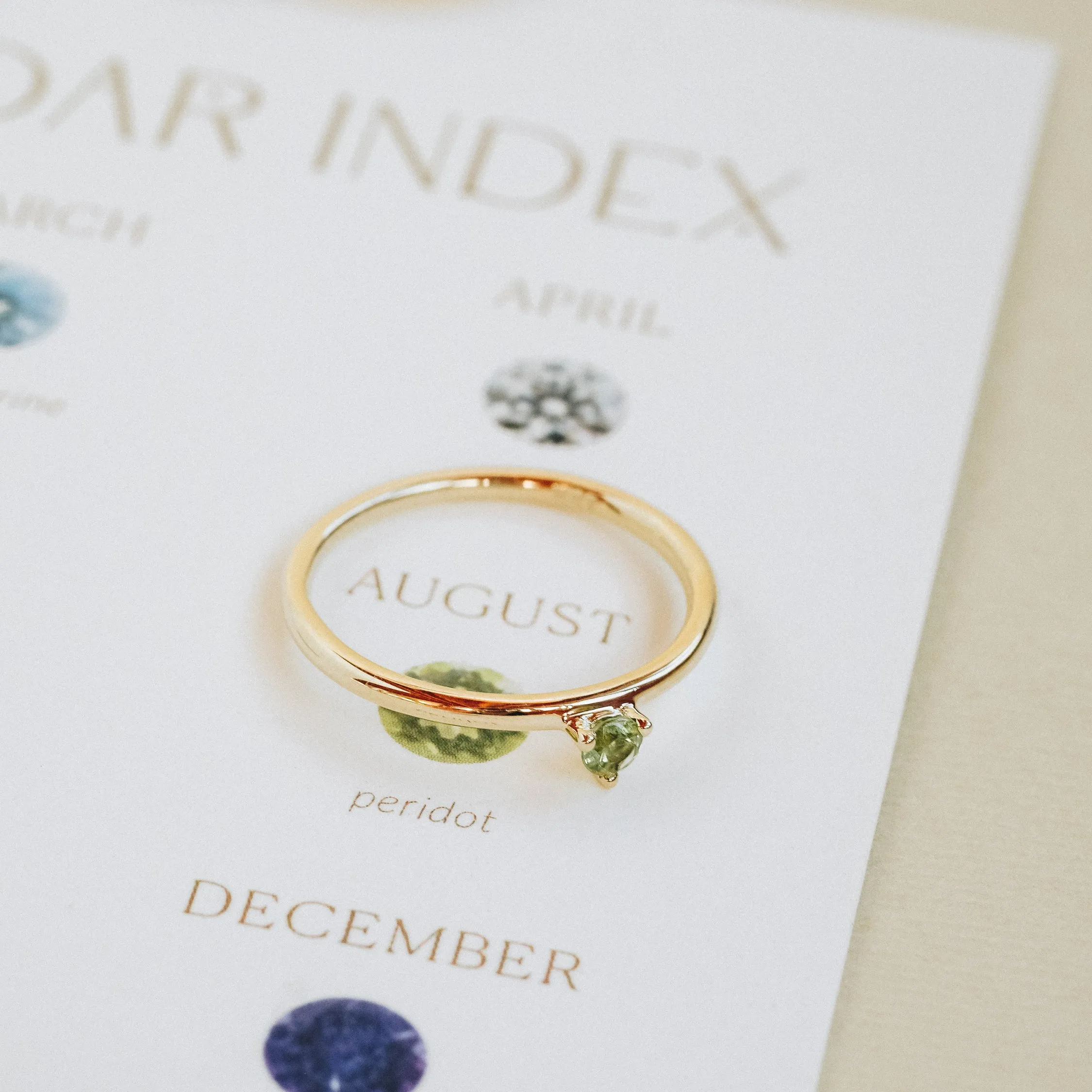Three Claw Mini Peridot Ring in Yellow Gold